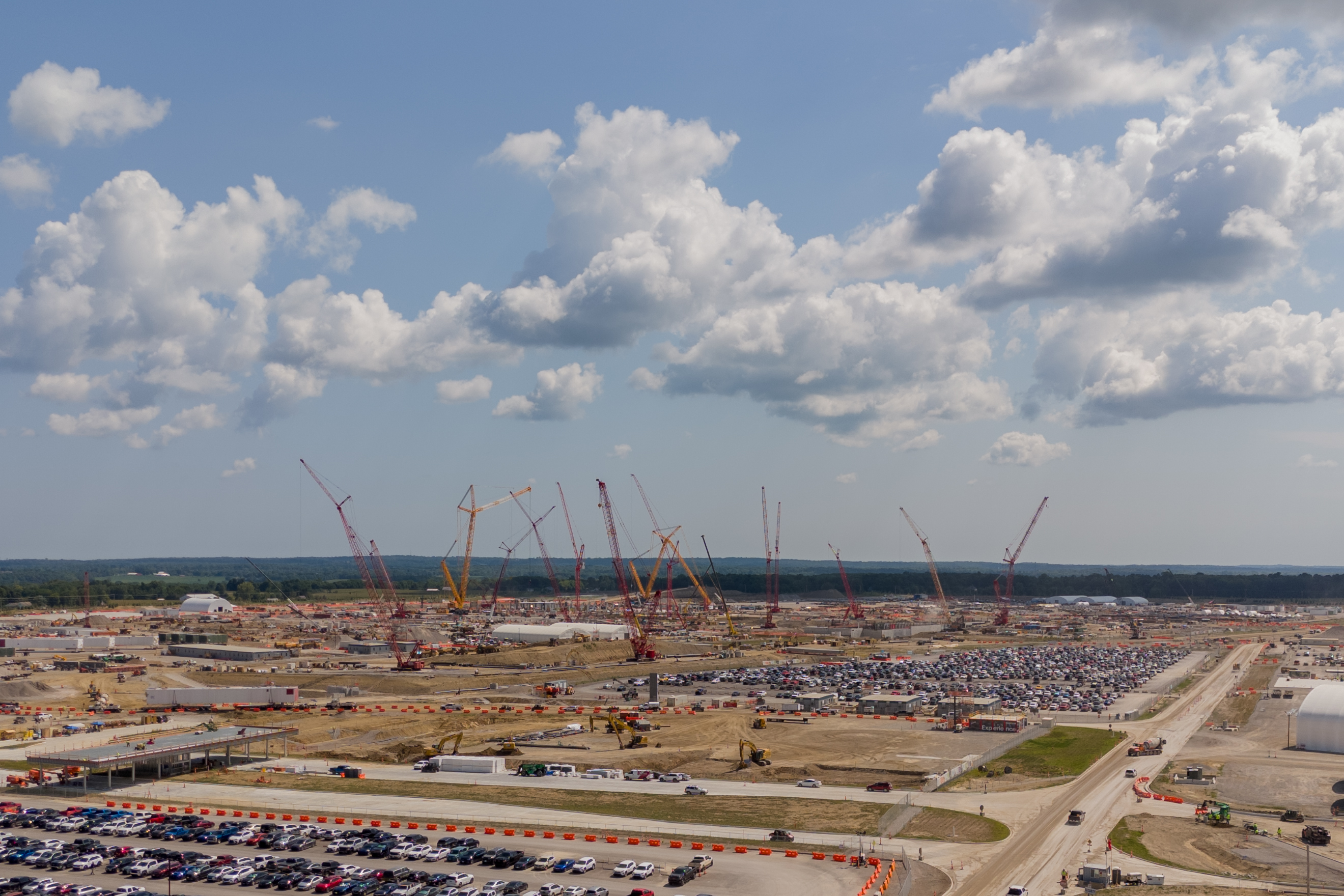 Dozens of large cranes in a building zone